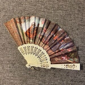 Elegant Decorative Hand Fan with Intricate Design